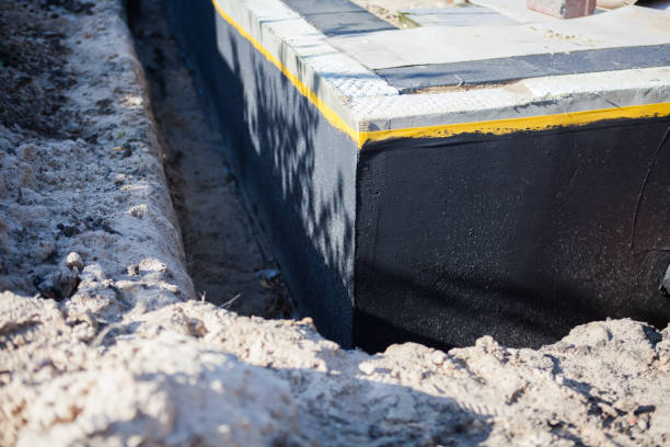 Professional Waterproofing technician working in Lakewood, NY